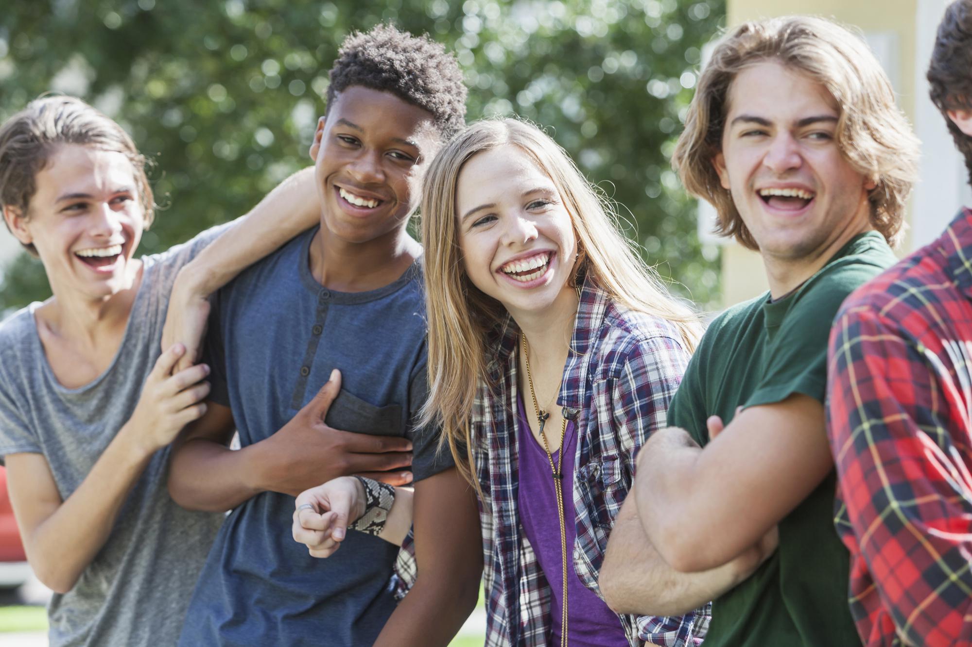 Four people laughing